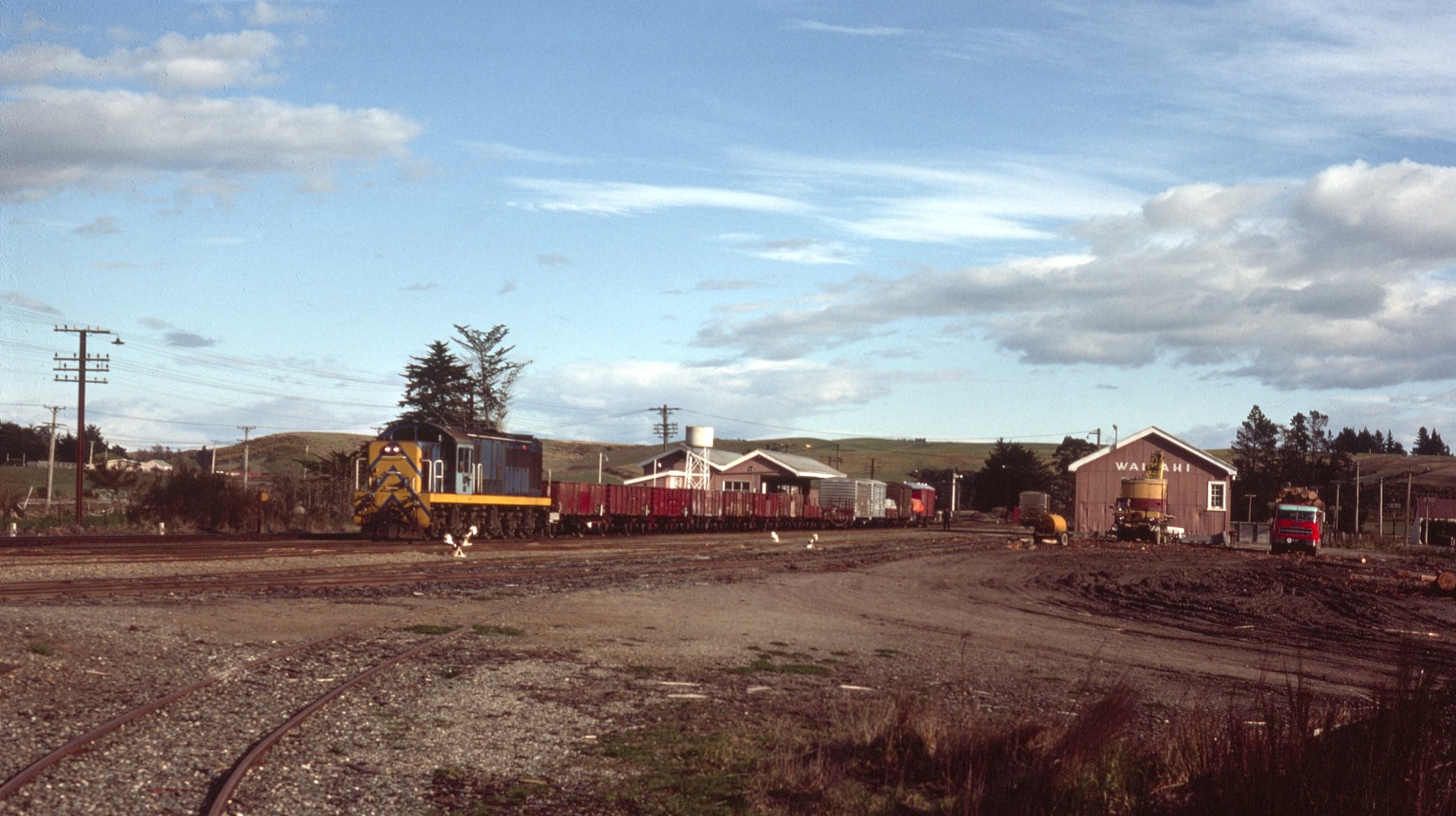 The Tapanui branch goods train to Heriot is about to leave the yards in this photograph from 1976...