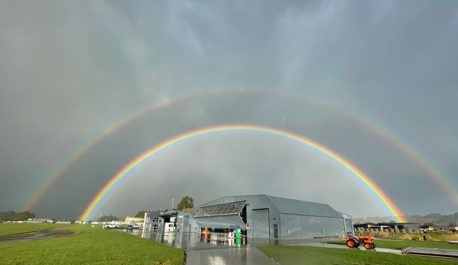 A double rainbow emerges over the Helicopter Otago base after an evening of thunder, lightning...