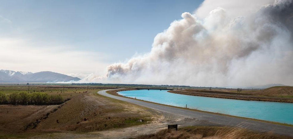 A plume of smoke rises from the Pukaki Downs fire on Thursday morning. Photo: Tom Neugebauer