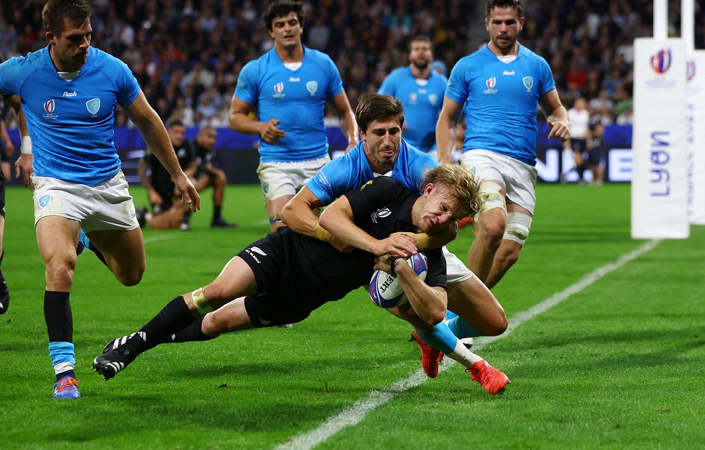 Damian McKenzie crashes over in a tackle to score the first try for the All Blacks against...