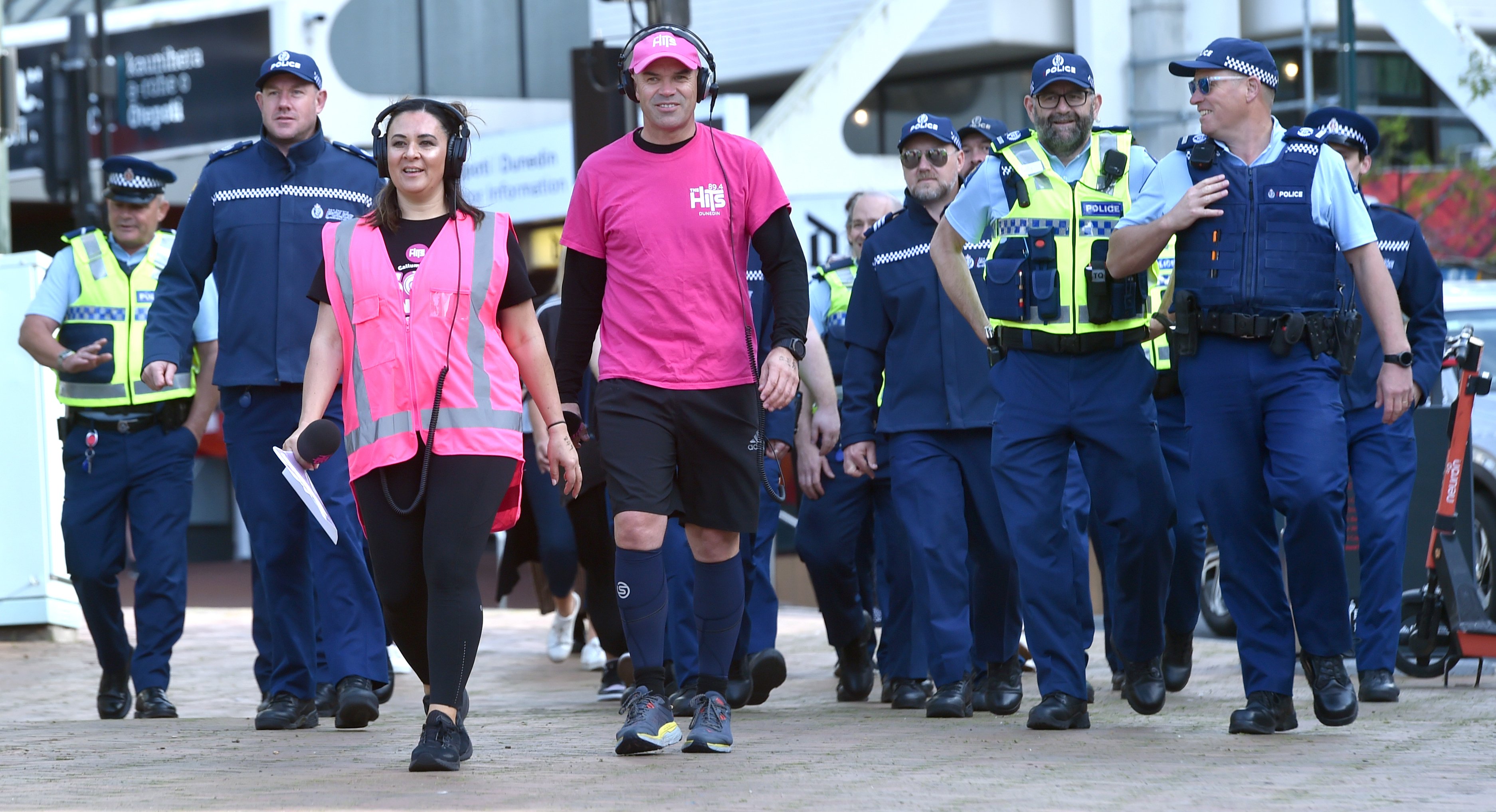 Police join radio hosts Patrina Roche and Callum Procter, who were walking around the Octagon for...