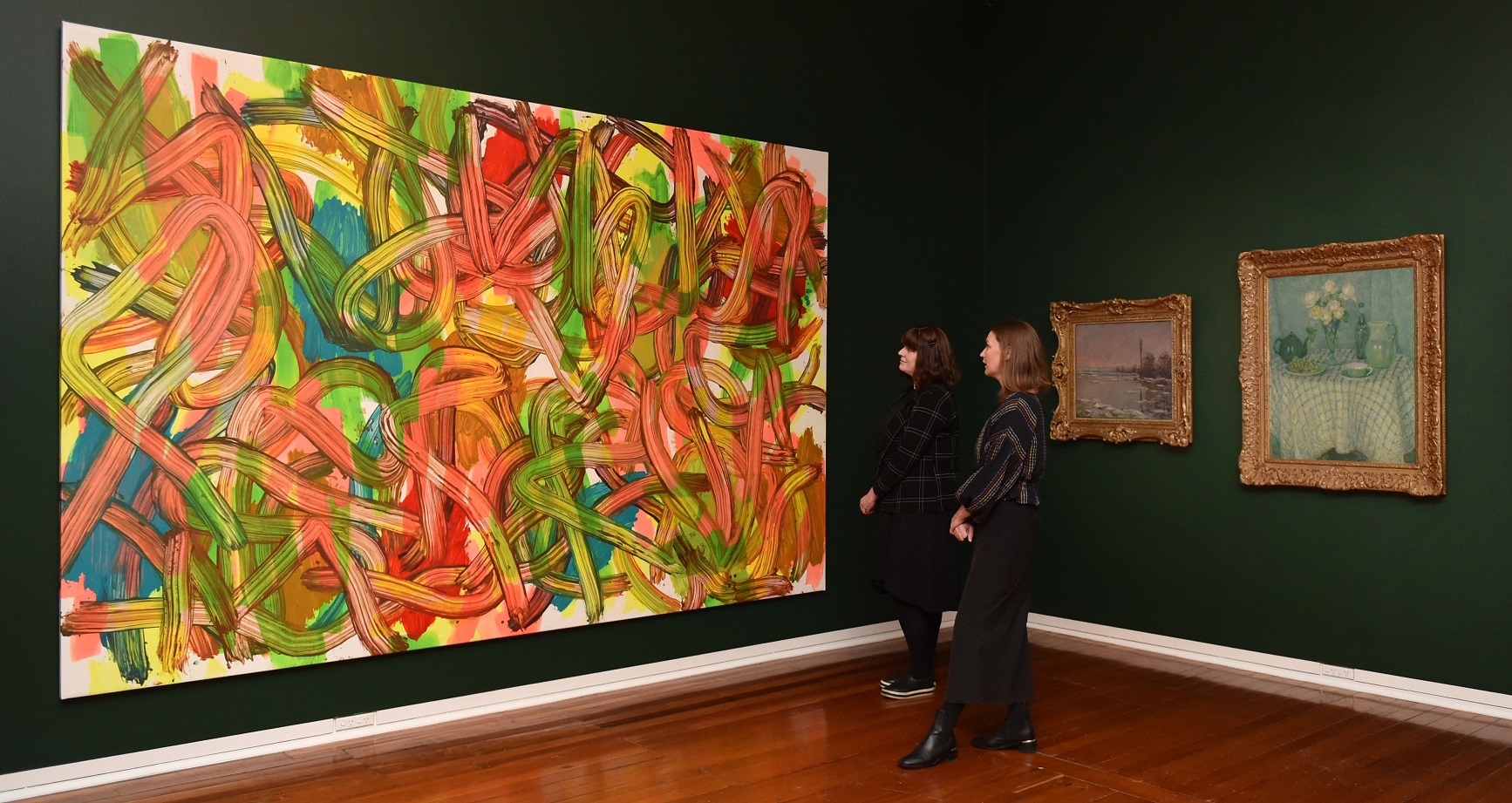 Dunedin Public Art Gallery curators Lauren Gutsell (left) and Lucy Hammonds admire Judy Millar’s...