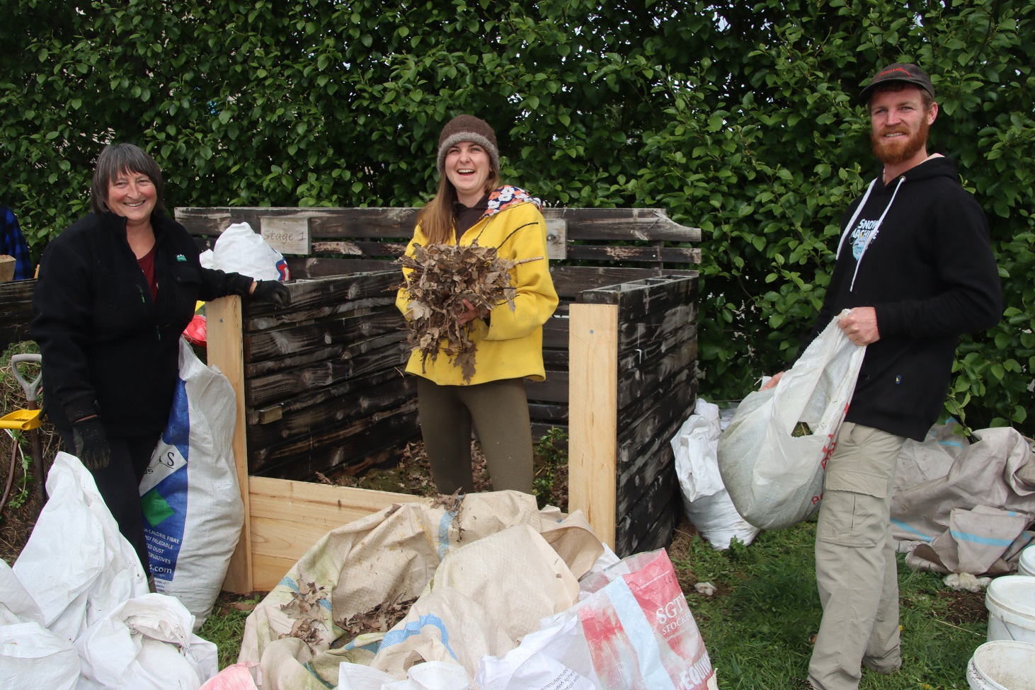 Riversdale Community Garden co-ordinator Zeb Horrell helps composting tutors Diana Davis (left)...