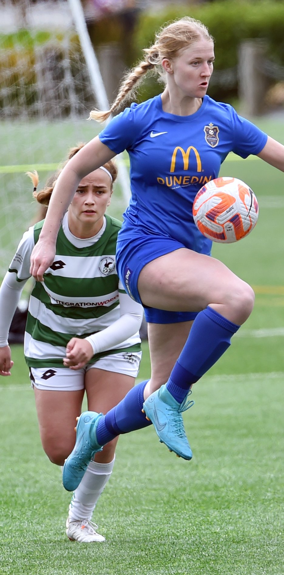 Amy Hislop controls the ball as Western Springs defender Lily Taitimu chases her down during...