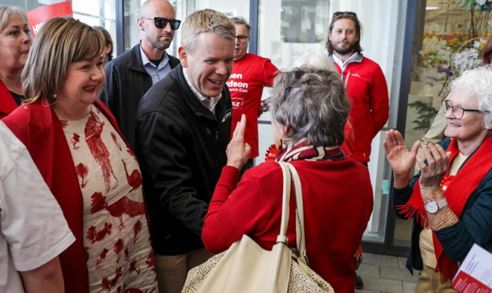 Chris Hipkins with Christchurch MP Megan Woods (left) greeting a supporter during a walkabout in...