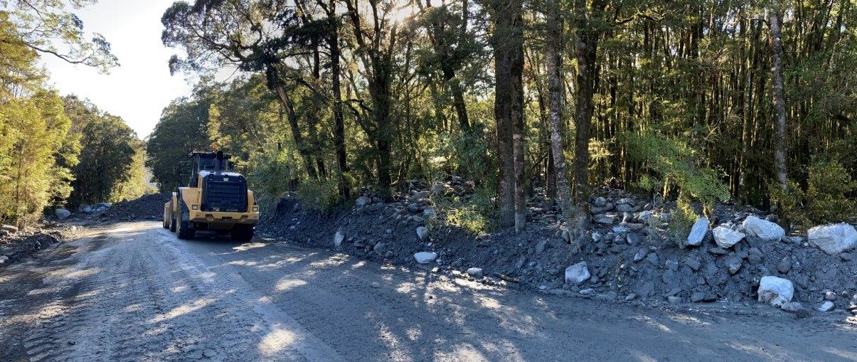 Slip material packed at the side of State Highway 6 as efforts to clear debris continues at the...