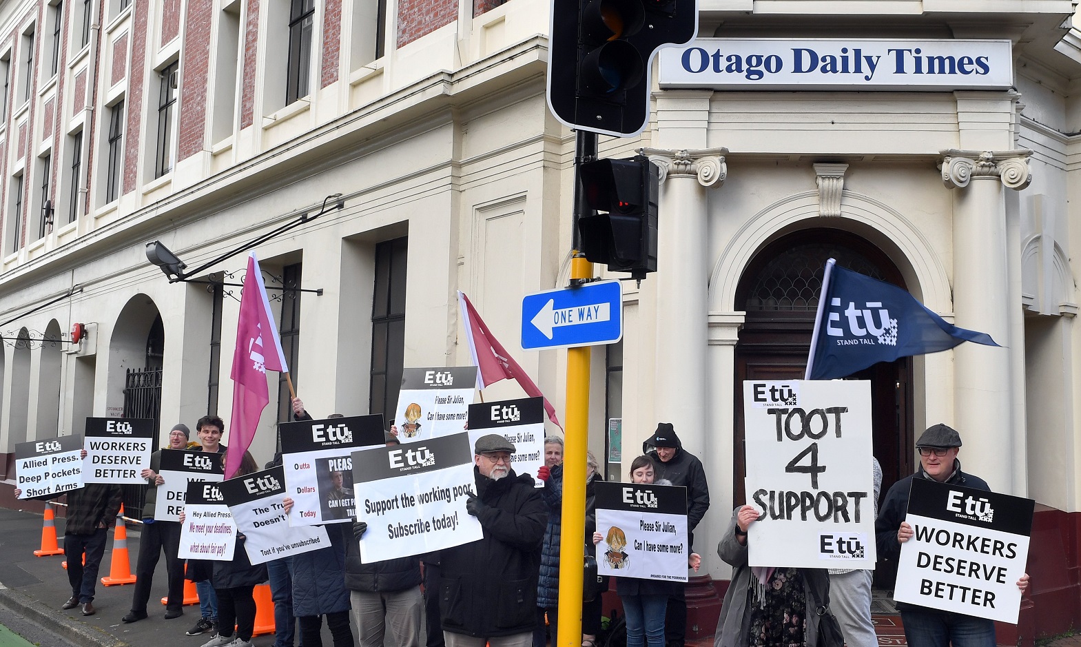 Allied Press staff picket outside the Dunedin office yesterday. Photo: Stephen Jaquiery