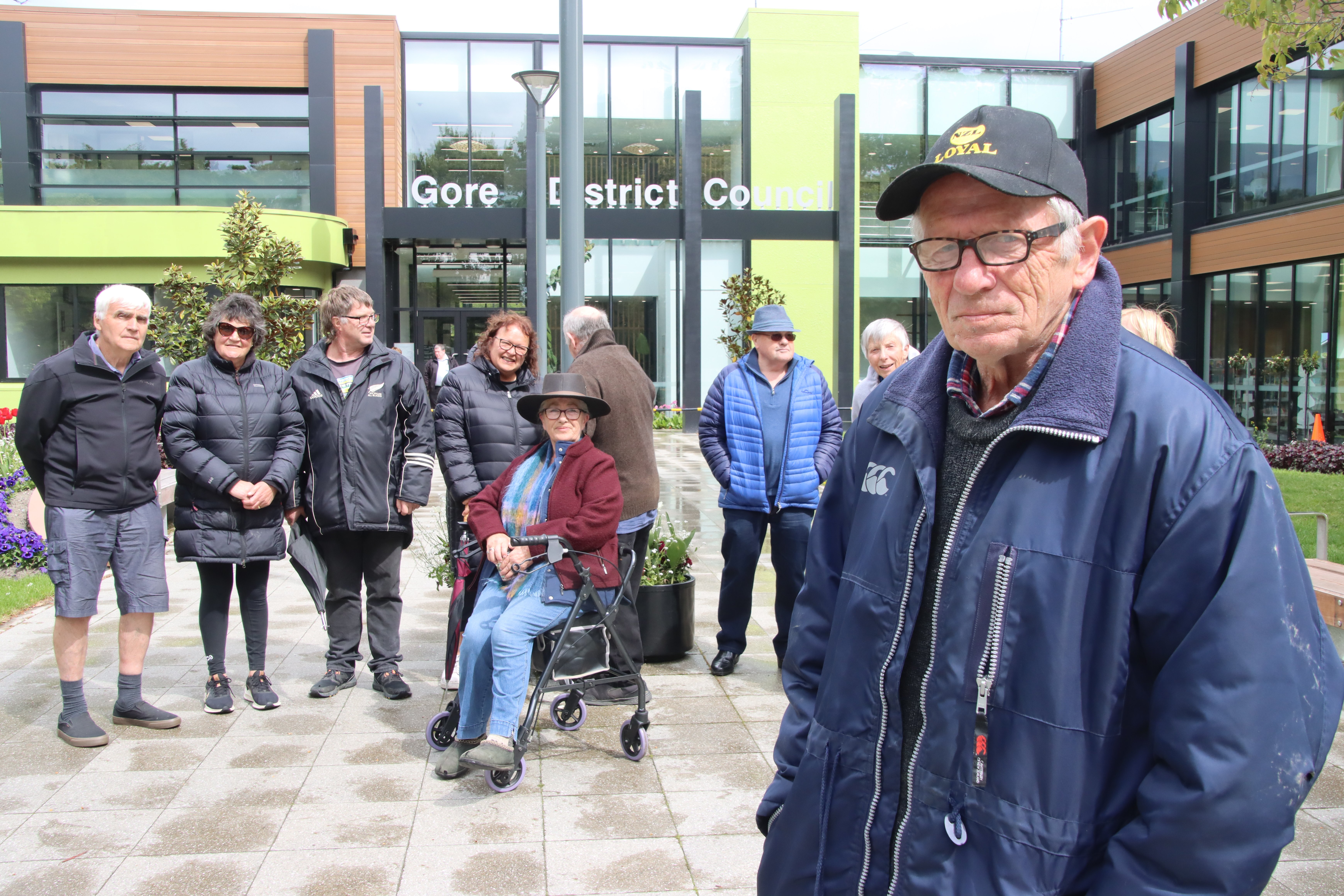 Gore District Citizen Action Group co-ordinator Jack McIntyre stands with a group of protesters...