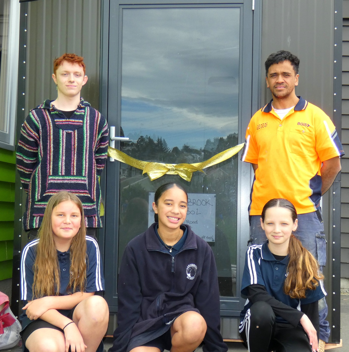 Building Boost programme participants Jayden Bishop (left) and Te Wai Neho hand over a deluxe...