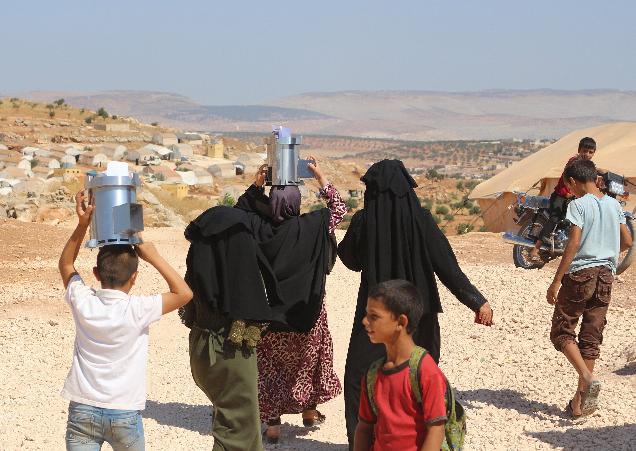 Displaced Syrian families receive Fire for Life stoves which are designed and made in Dunedin....