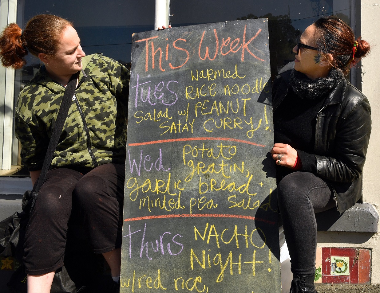 Sam Fitzgerald and Raukura Tutahione check the week’s menu.