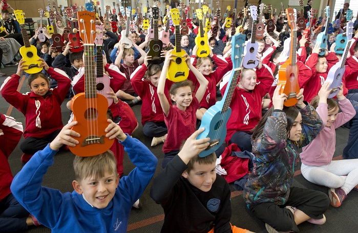 Primary school pupils from across Dunedin raise their ukuleles in salute as they begin  the 12th...