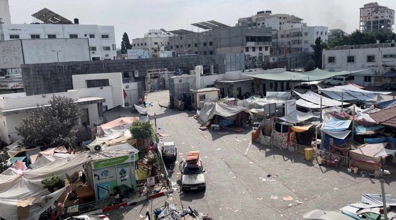 Tents and shelters used by displaced Palestinians stand at the yard of Al Shifa hospital during...