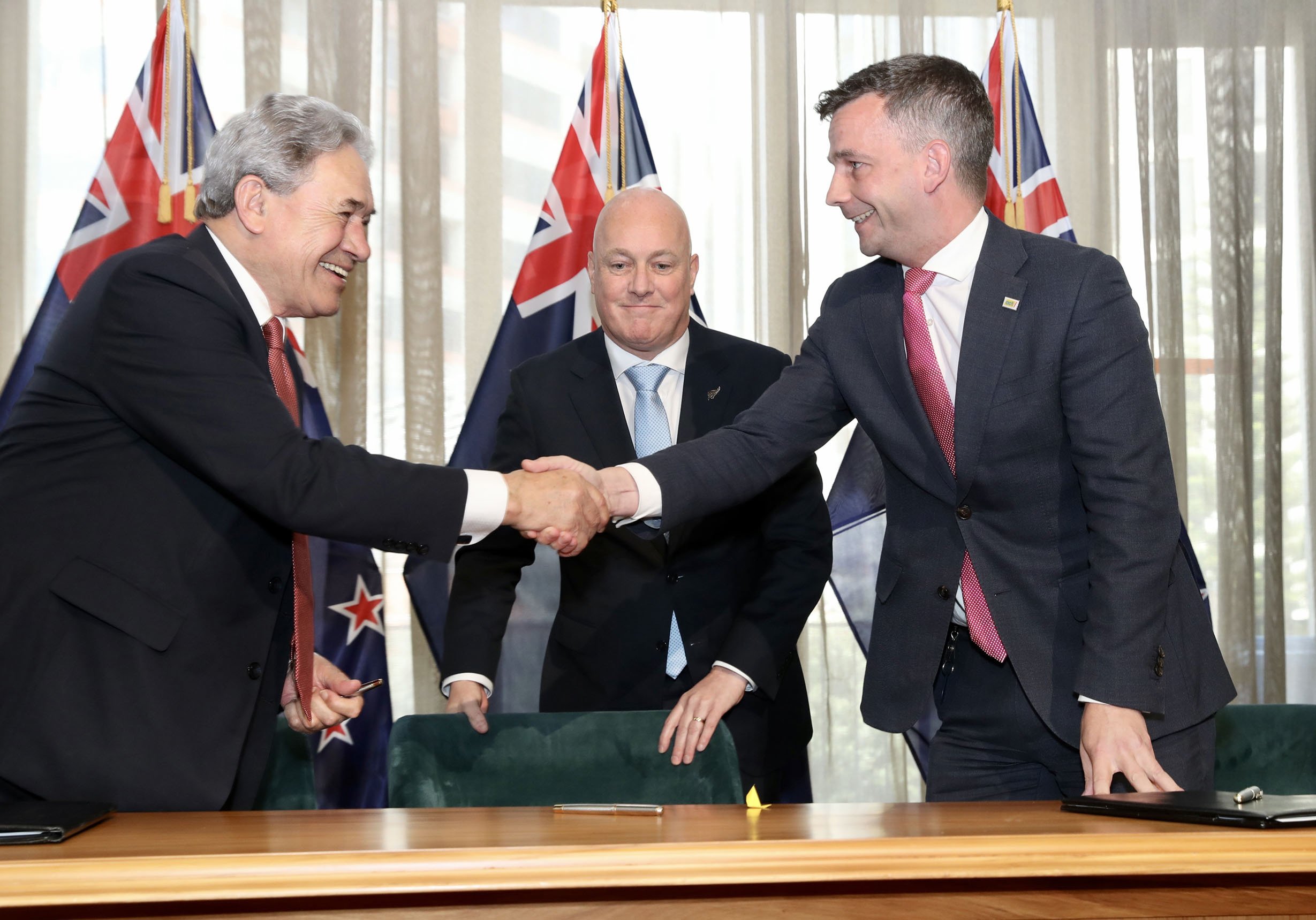 New Zealand First leader Winston Peters (left) and Act New Zealand leader David Seymour shake...