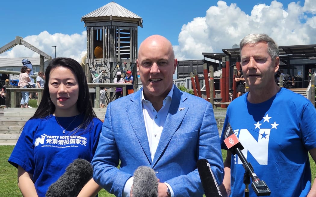 Incoming Prime Minister Christopher Luxon (centre), with Nancy Lu (left) and MP Andrew Bayly ...