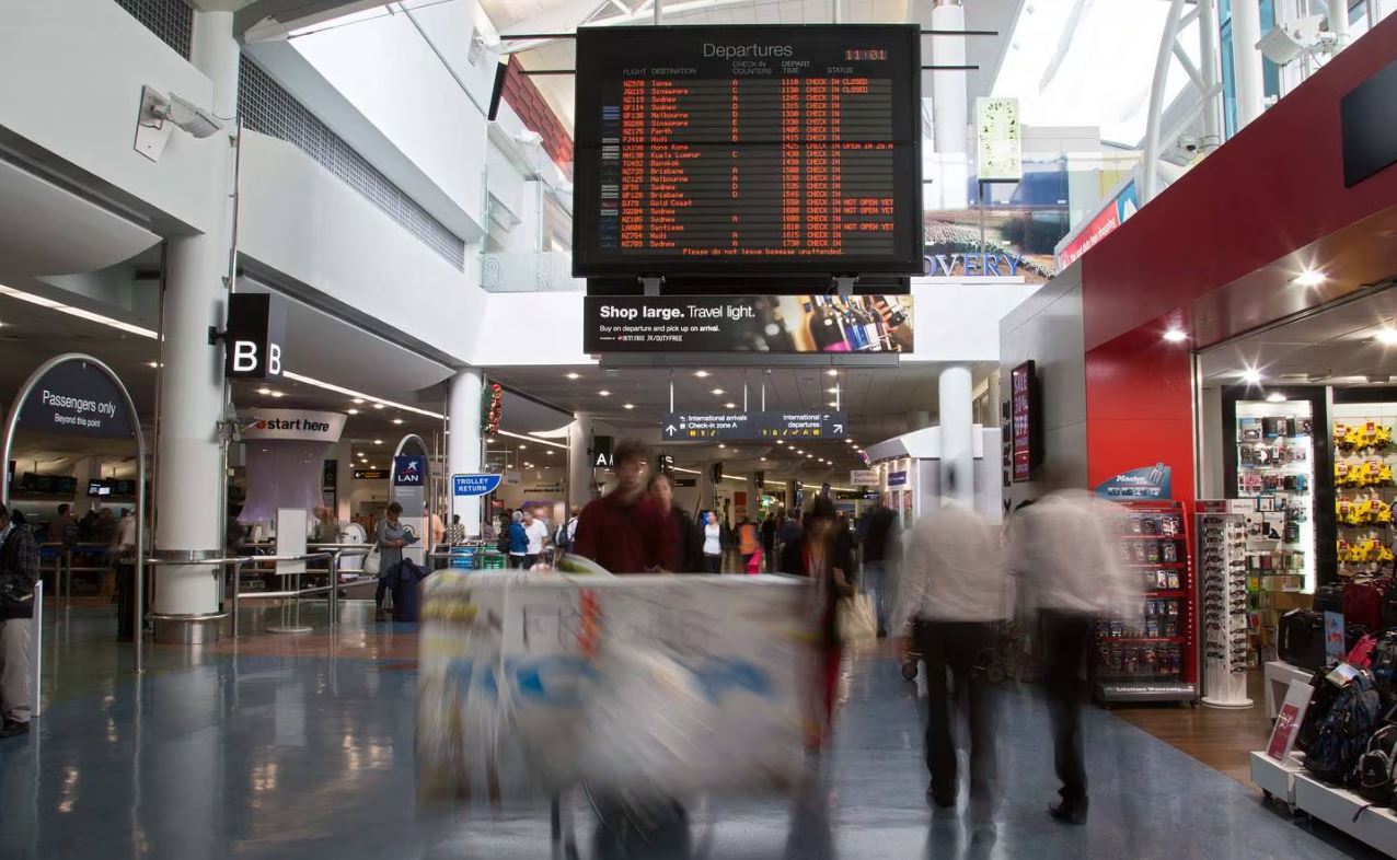 Chaotic scenes at Auckland Airport today have seen huge crowds and hour-plus delays to...