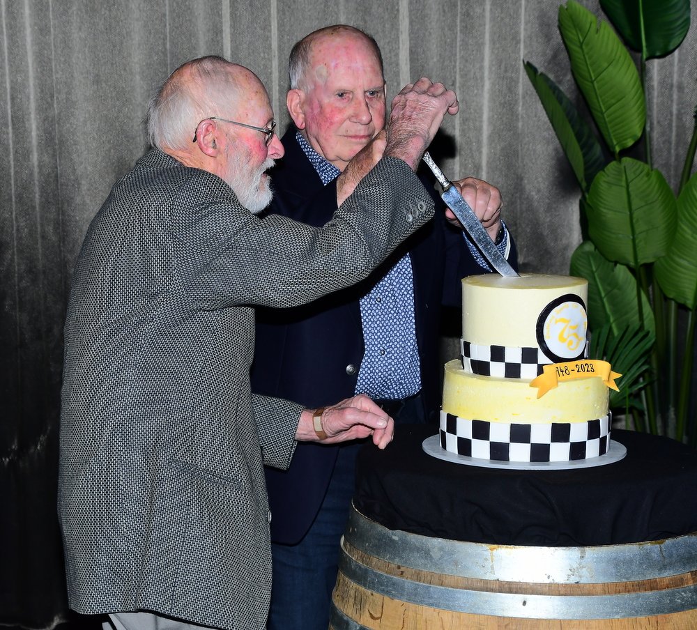 Southland Sports Car Club Life Members York Wills (Left) and Barry Keen cut the SSCC 75th...