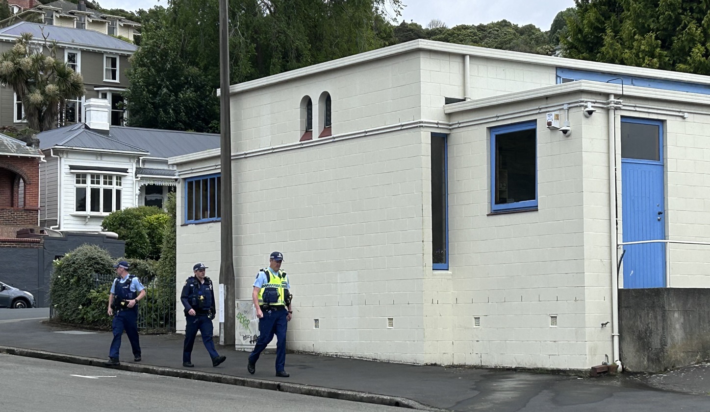 Police at the Dunedin Synagogue, which was one of the places that received a threat. Photo:...