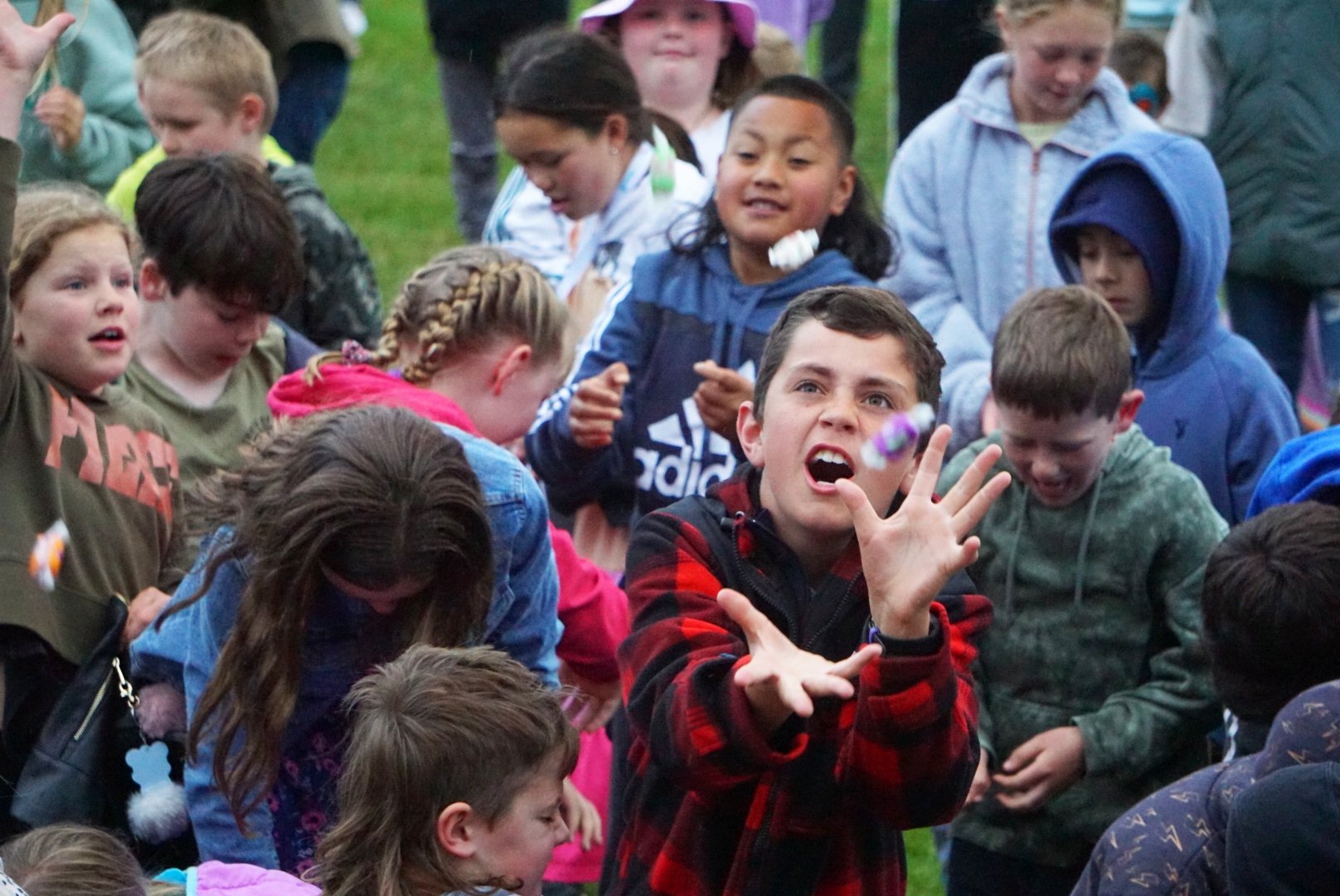 Lockhart Easton catches a grape-flavoured candy at the Weston School Fireworks at the Weston...