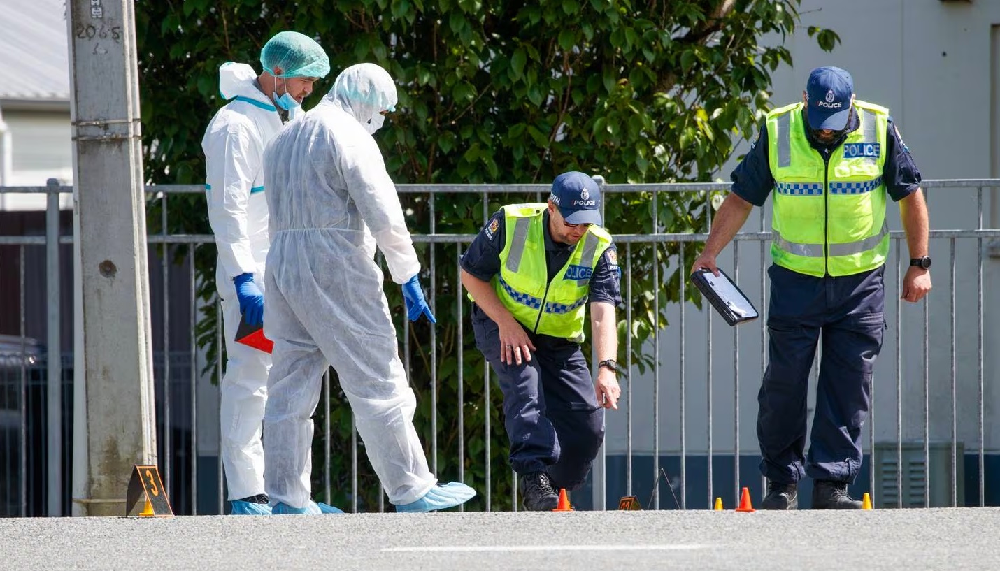 Police at the scene of the hit-and-run incident on Naenae Rd. Photo: NZ Herald 