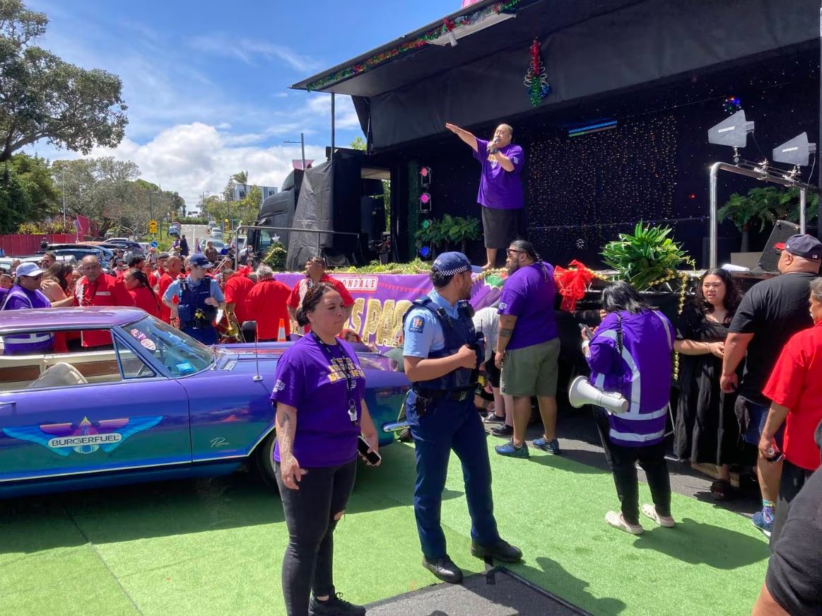 A BurgerFuel car collided with a brass band at the Avondale Santa parade.