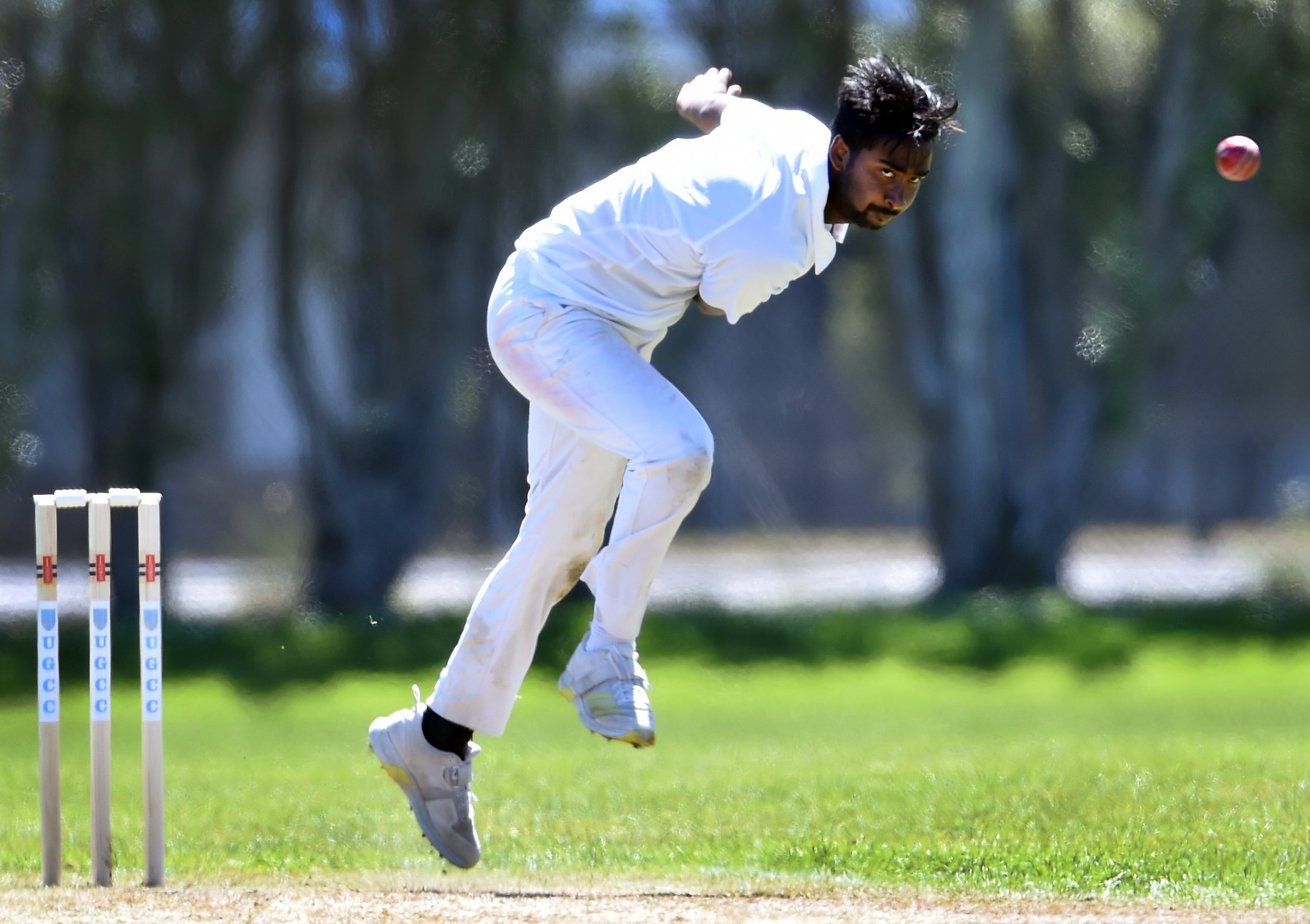 University-Grange seamer Shiv Achary sends down a delivery against CDK at Logan Park on Saturday....