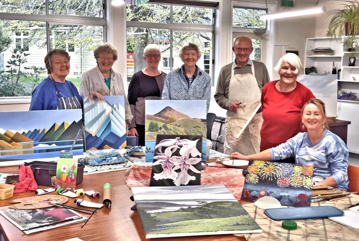 Preparing for their "Art in November" annual group exhibition are local artists (from left) Julia...