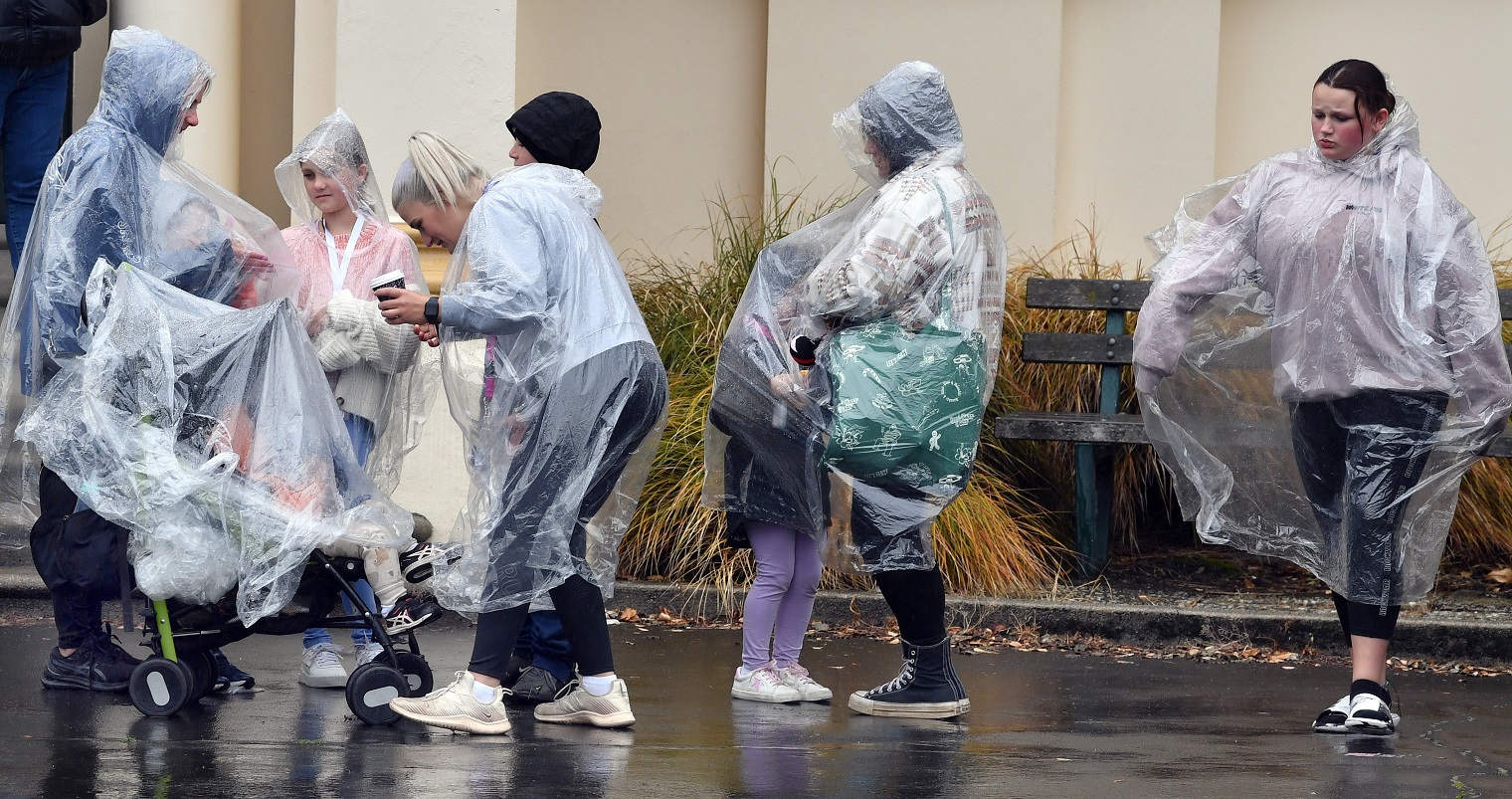 Cruise ship passengers brave the rain as they explore Port Chalmers. Photos: Stephen Jaquiery