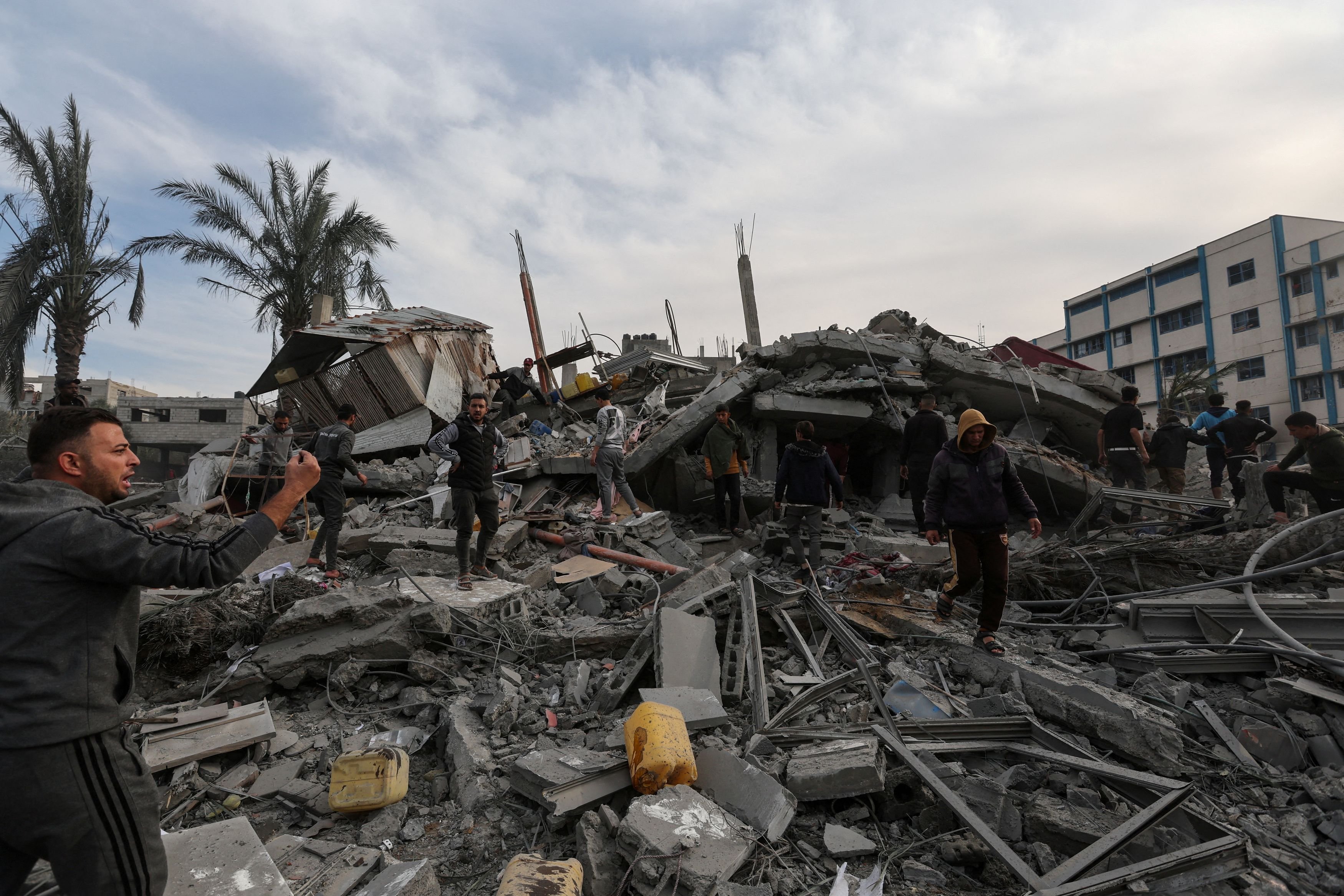 Palestinians search for casualties after an Israeli attack on Rafah, in the southern Gaza Strip....