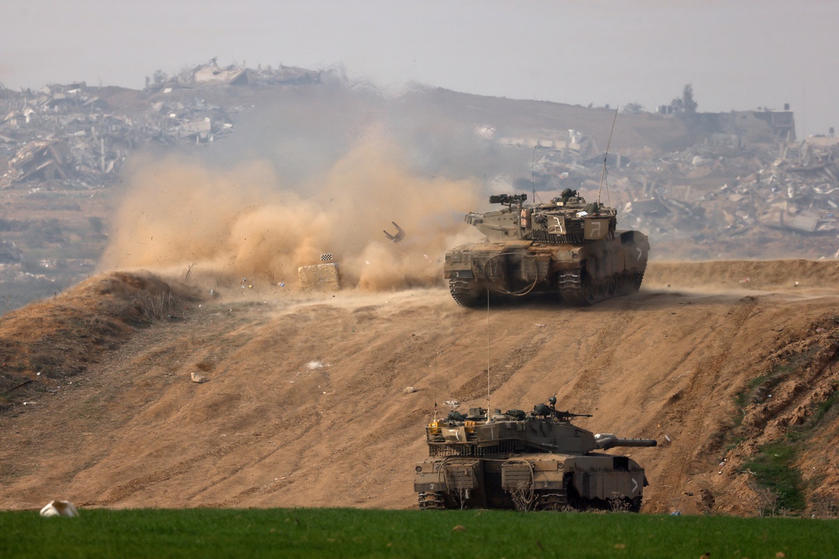 An Israeli tank fires towards Gaza at the border in southern Israel. Photo: Reuters