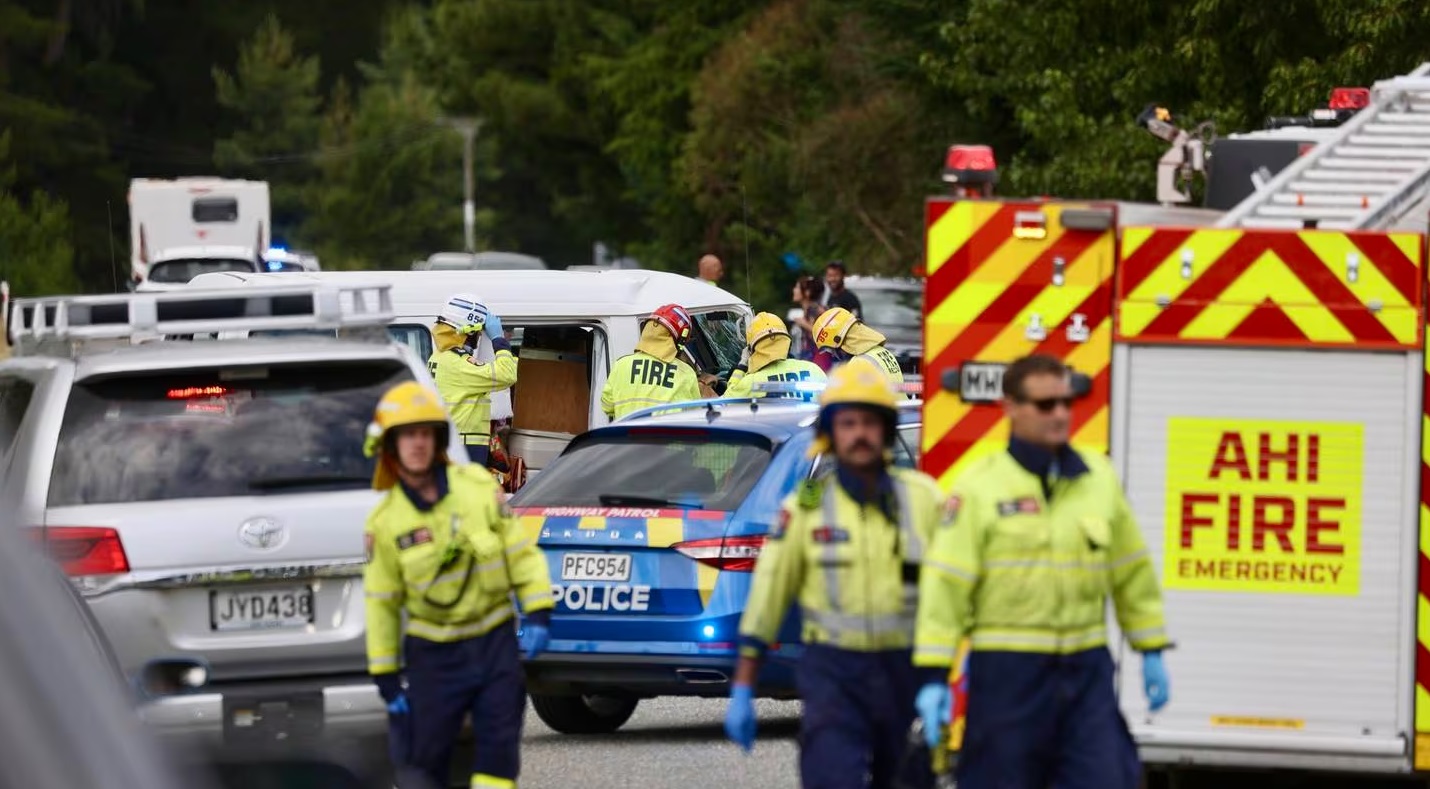 Emergency services at the crash scene this afternoon. Photo: NZ Herald