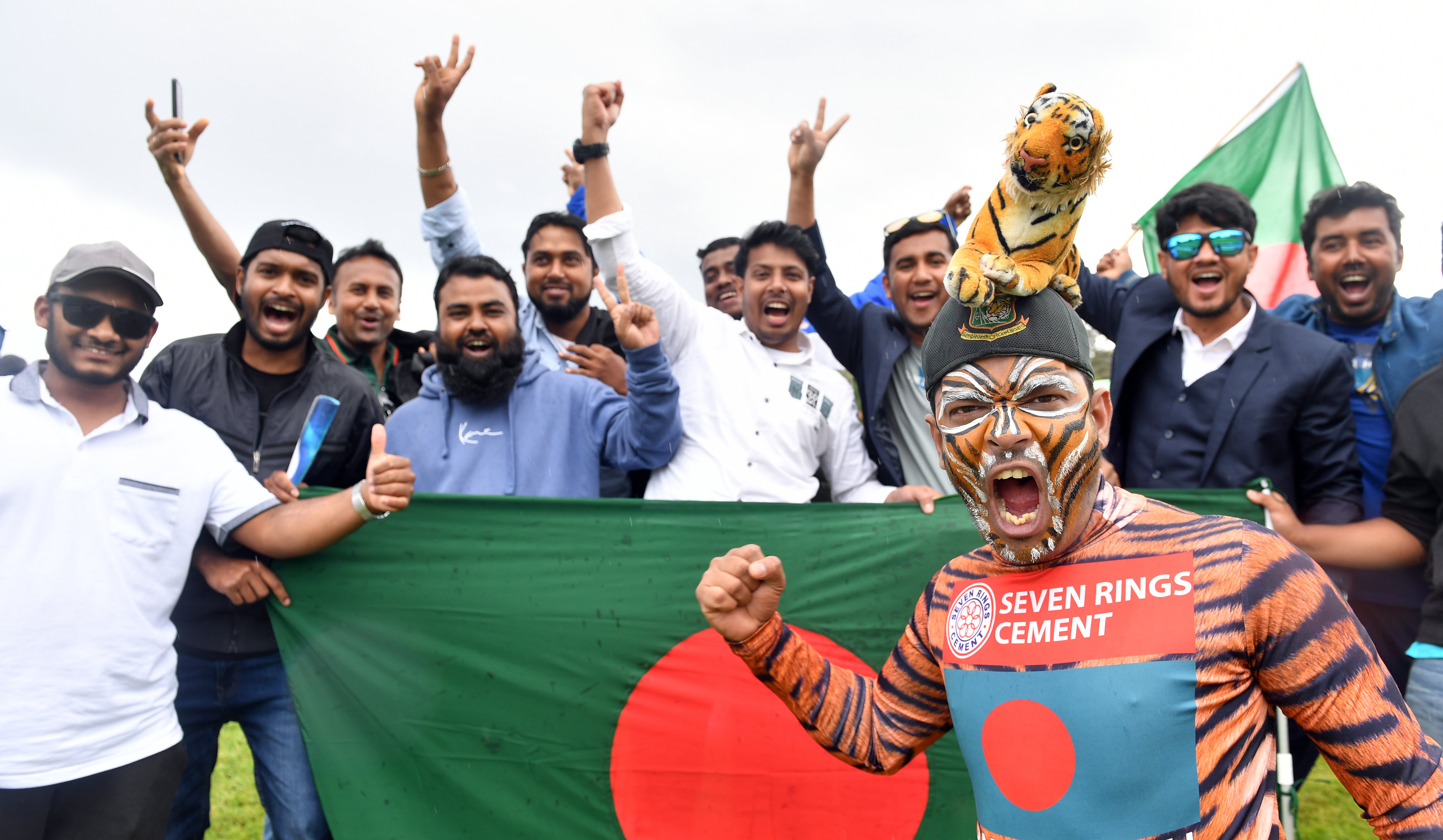 Bangladesh super-fan Shoyab Ali in full roar surrounded by his mates at the ODI between New...