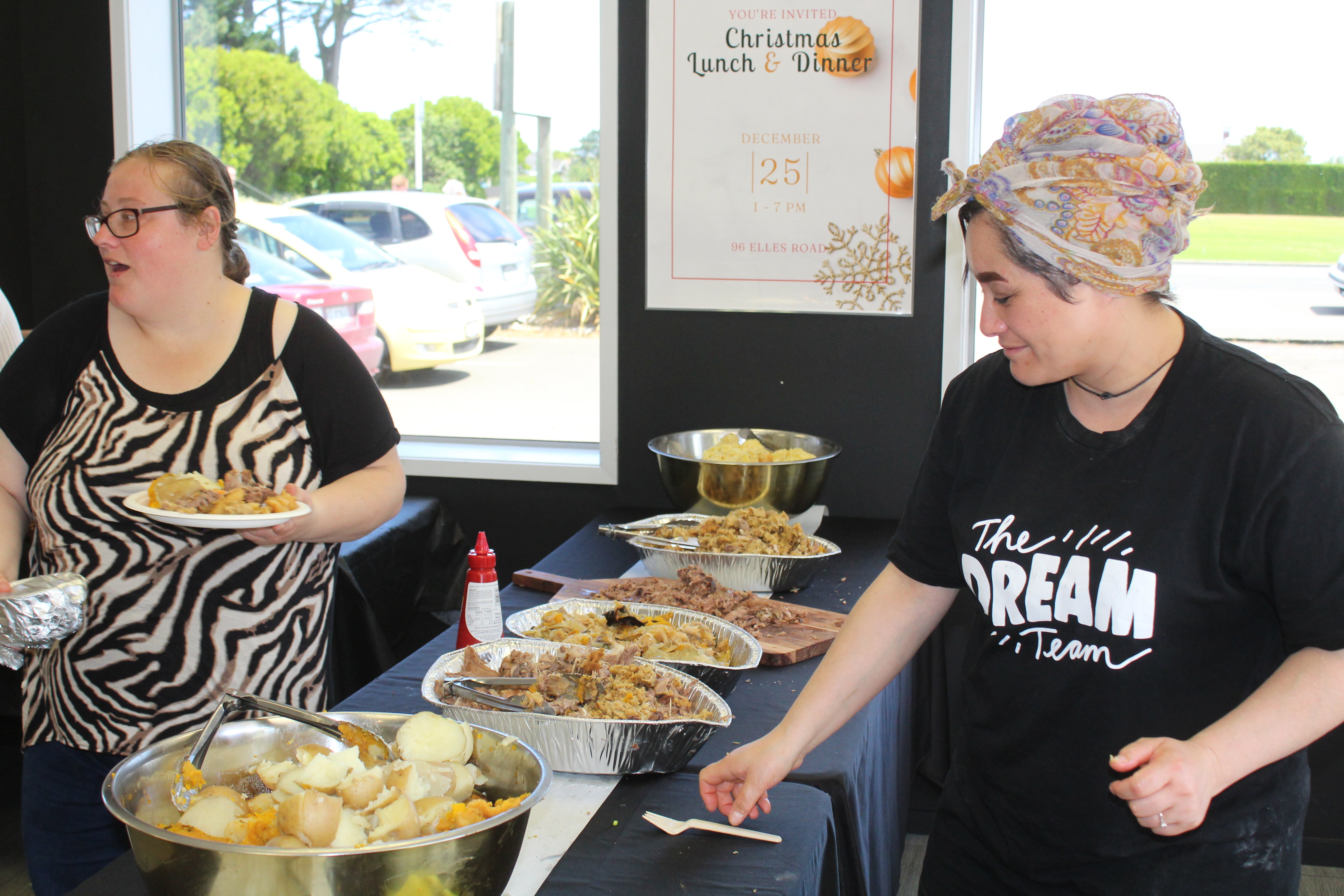 Elim Community Church helpers are stoked to serve their community a hangi meal on Christmas Day....