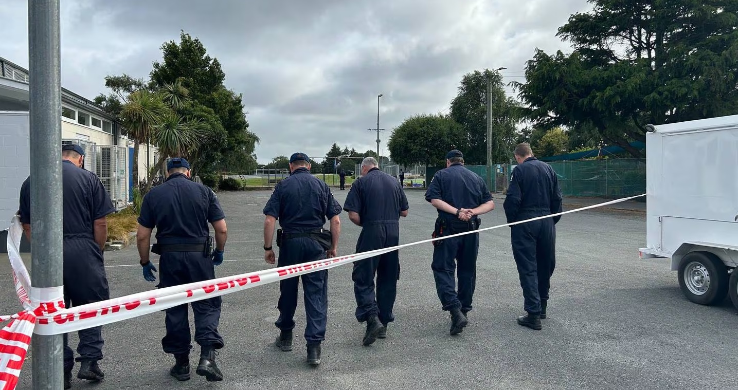 Forensic police officers undertaking a scene examination. Photo: NZ Herald