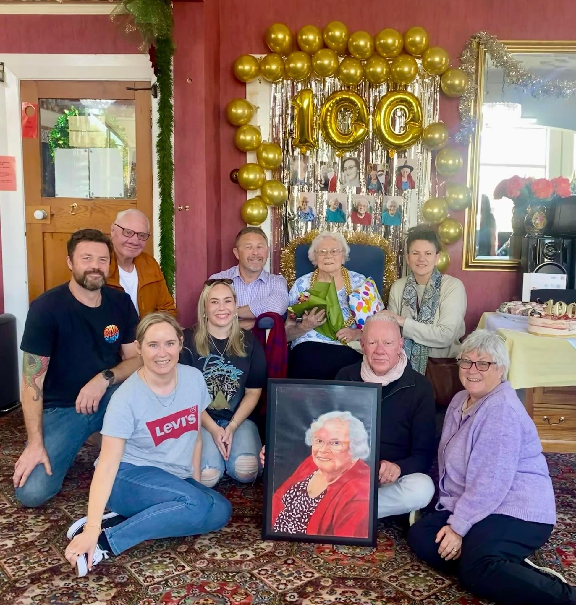 Joyce Meldrum celebrates her 100th birthday on Monday with family members at Queen Rose...