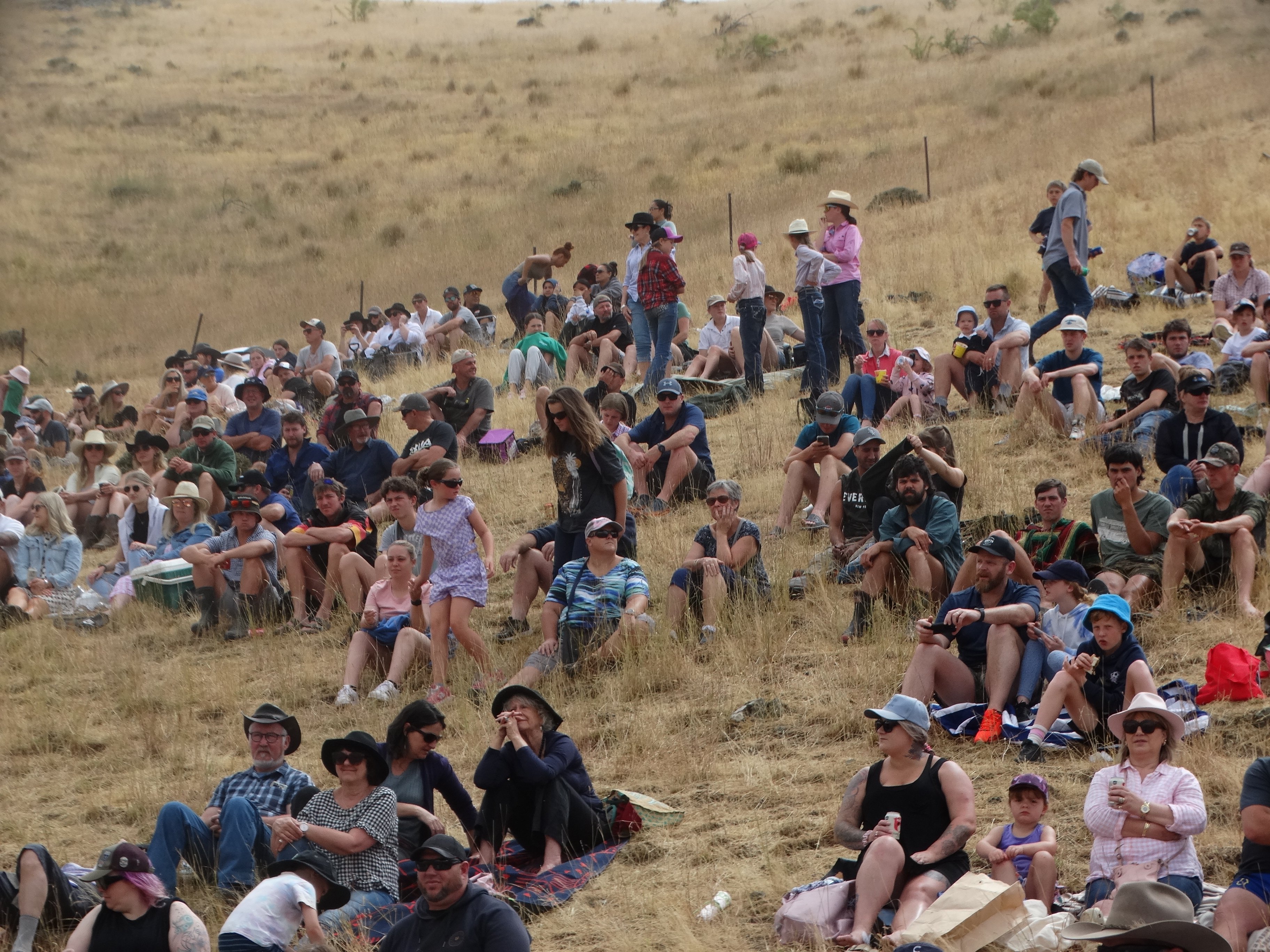 More than 1000 spectators watch proceedings from their hill vantage point.