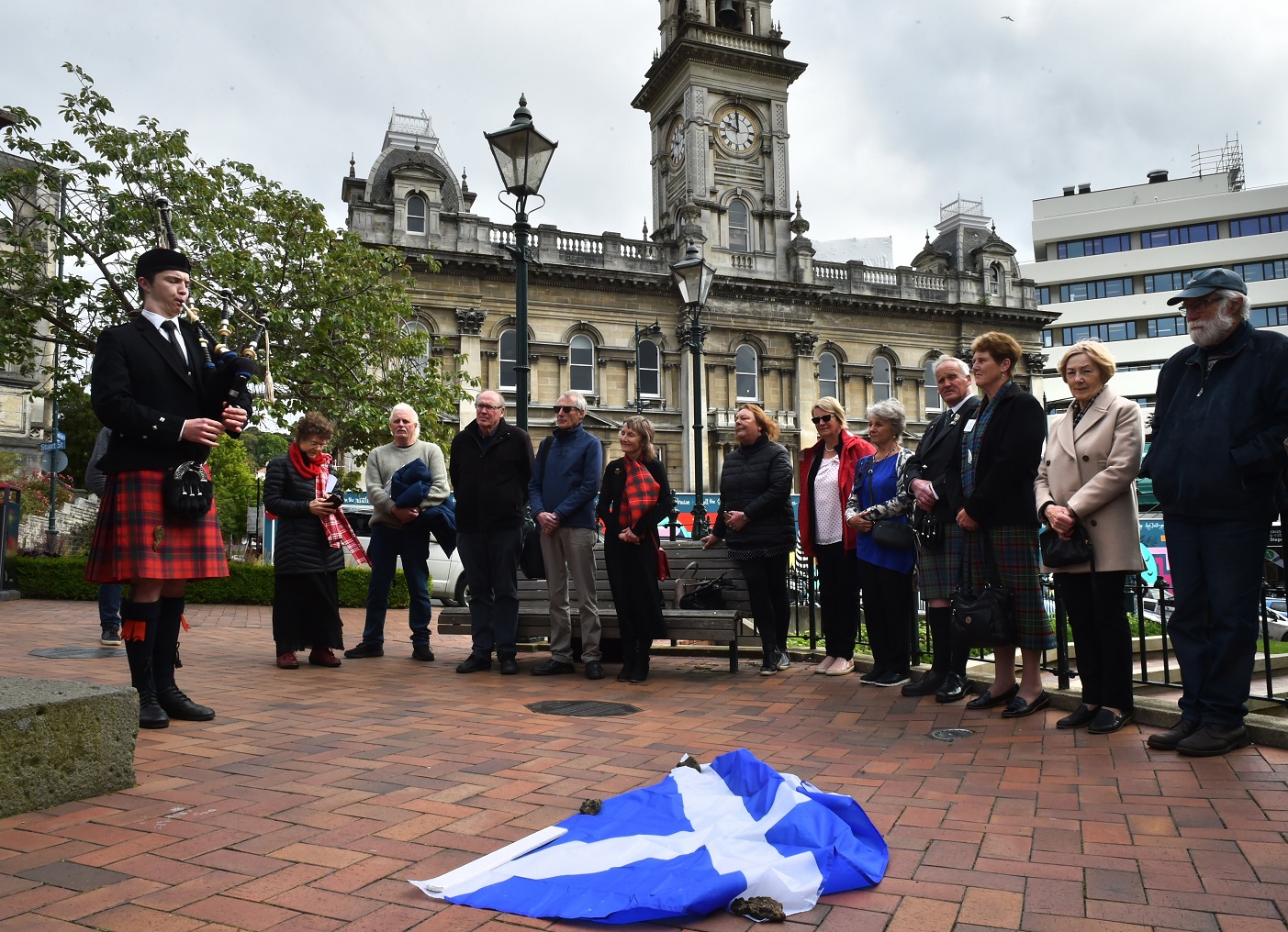 City of Dunedin Pipe Band piper Oe Hayward plays during the unveiling ceremony for Angus...