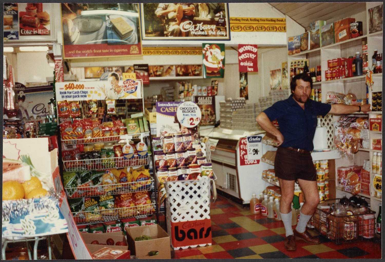 Alan Dick minds the shop in his Discount Foods store, in Cromwell, in November 1984. The building...