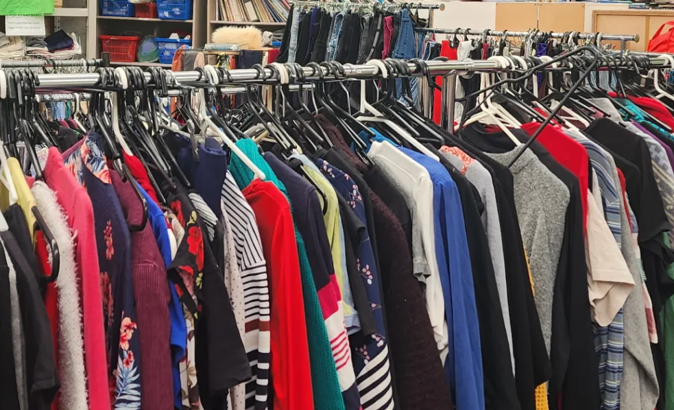 Racks of donated clothing at the Porirua Free for All store. Photo: RNZ / Supplied