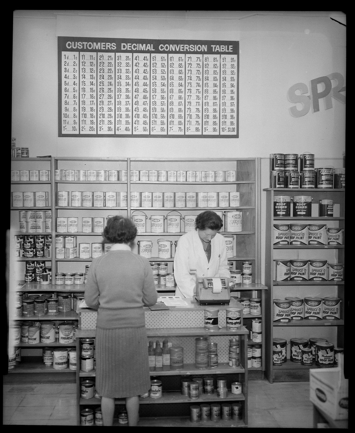 A decimal currency conversion chart in a Dulux paint shop. Photo: Evening Star Collection