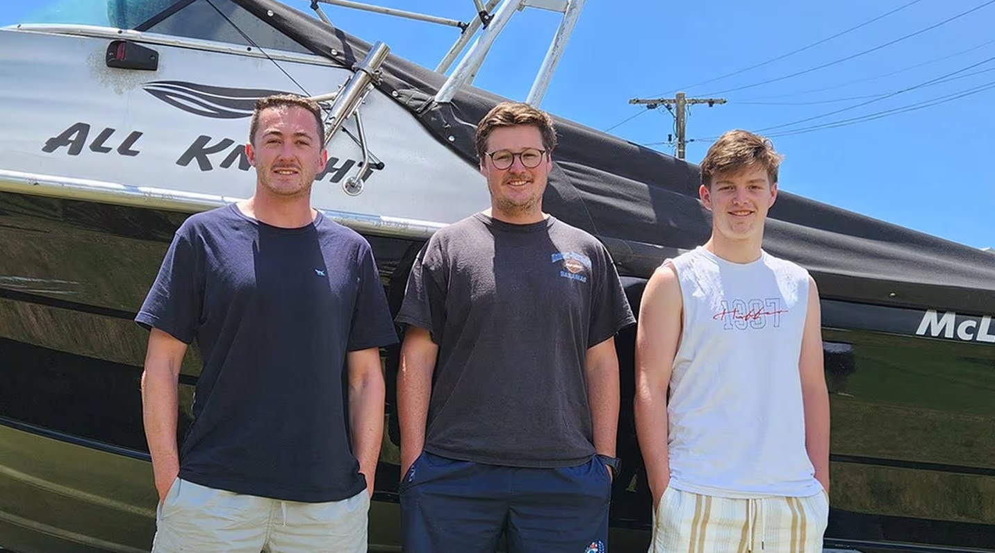 Max White (left), James McDonnell and Tyler Taffs were fishing near Mayor Island when they came...