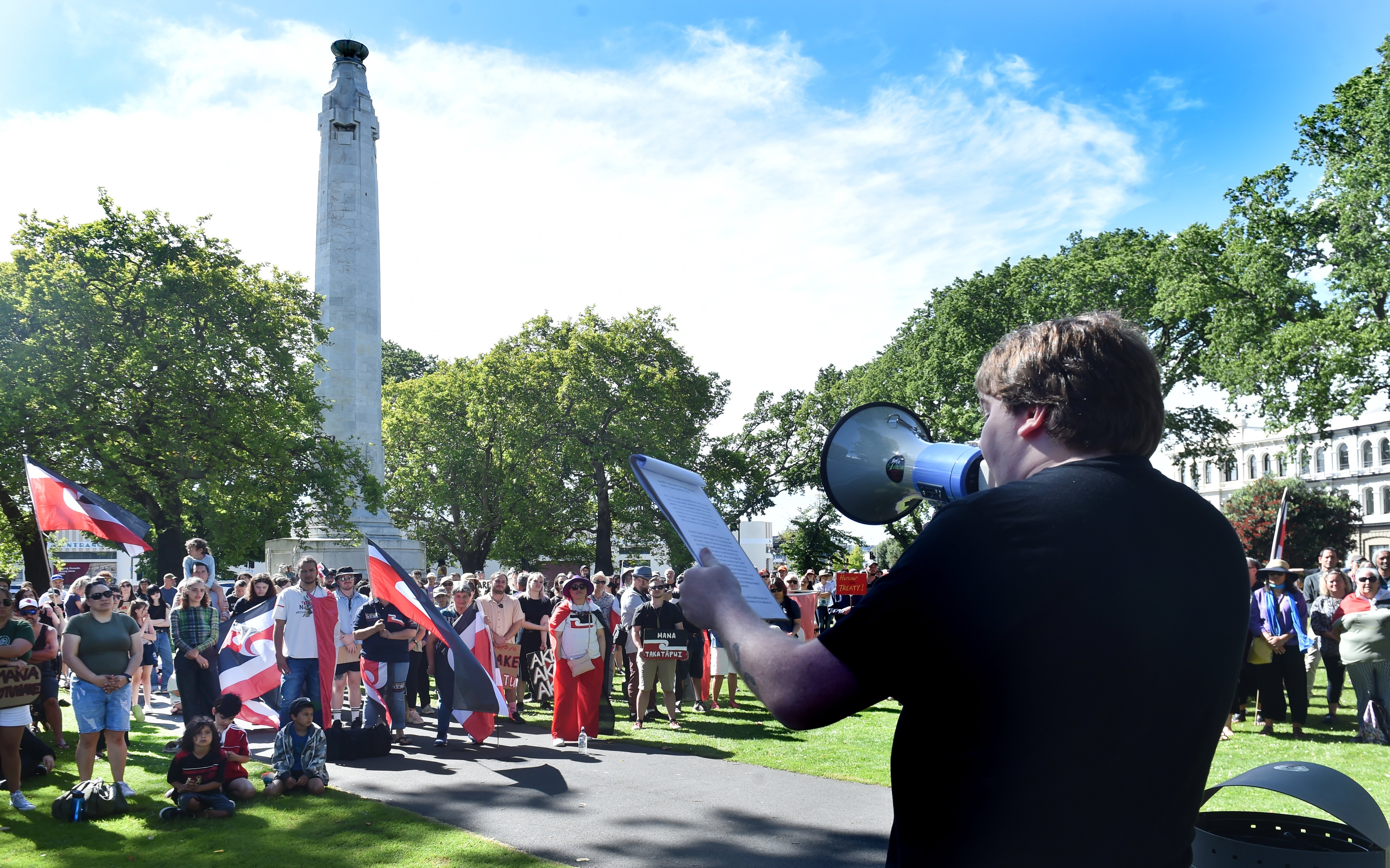 Josh Stewart makes a speech to a crowd of 200 fellow protesters at the Toitū Te Tiriti: Ōtepoti...