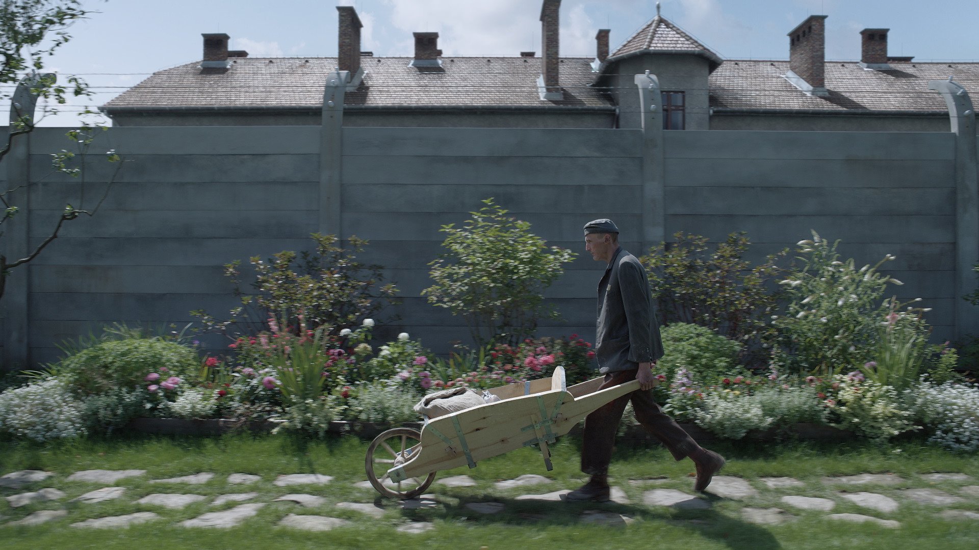 At one point in the film a garden labourer spreads ashes from the camp over the soil of Hedwig...