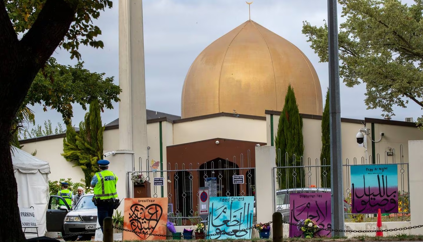 A police officer keeps watch at Al Noor mosque in Christchurch on the first anniversary of the...