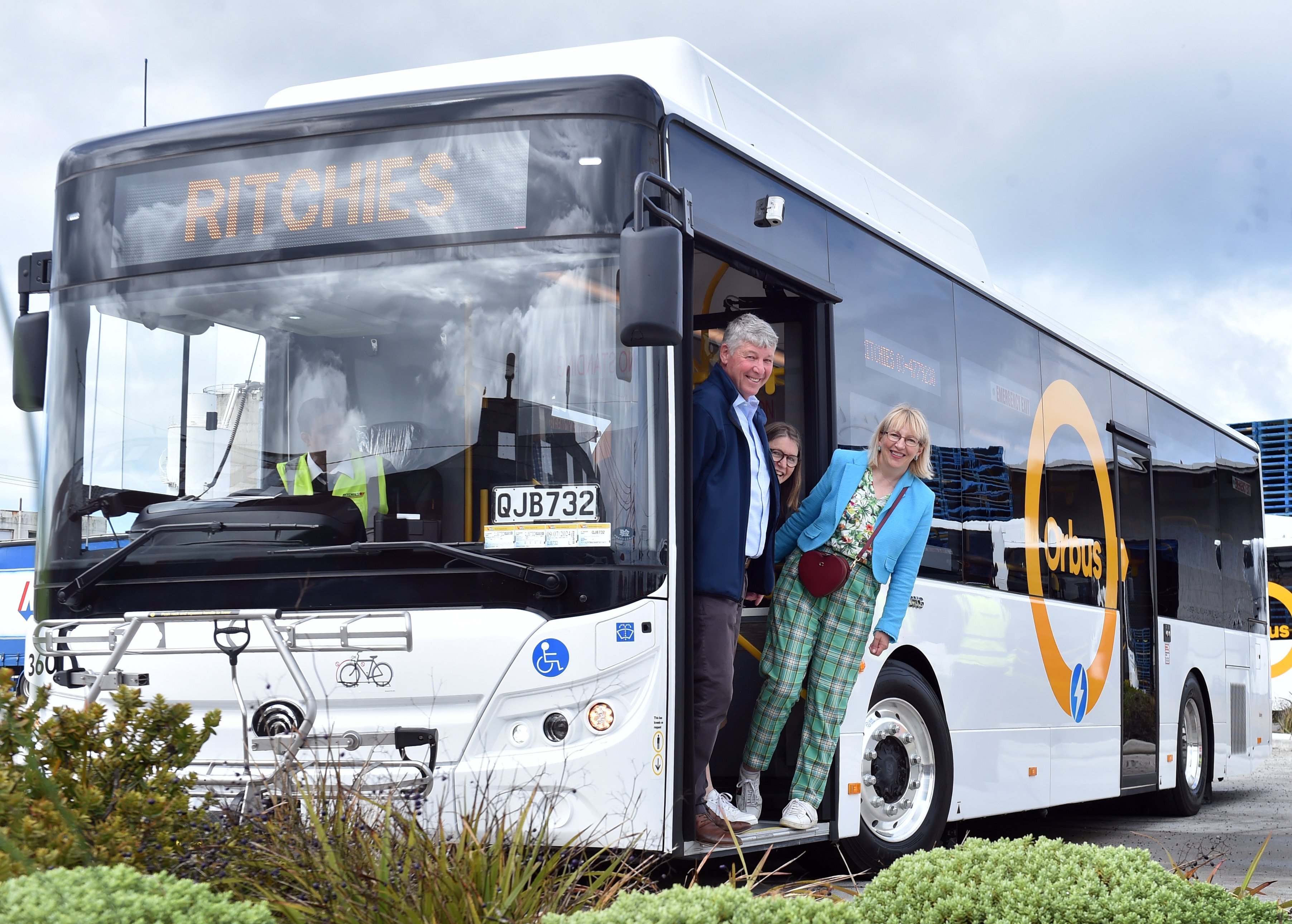 Having a test run on a new electric bus are (from left) Otago regional and Dunedin city...