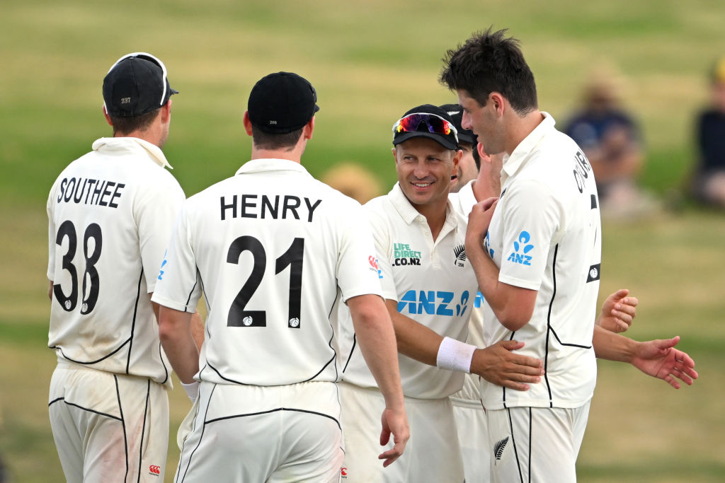 Black Caps players celebrate with Will O'Rourke (R) after his dismissal of South Africa's Dane...