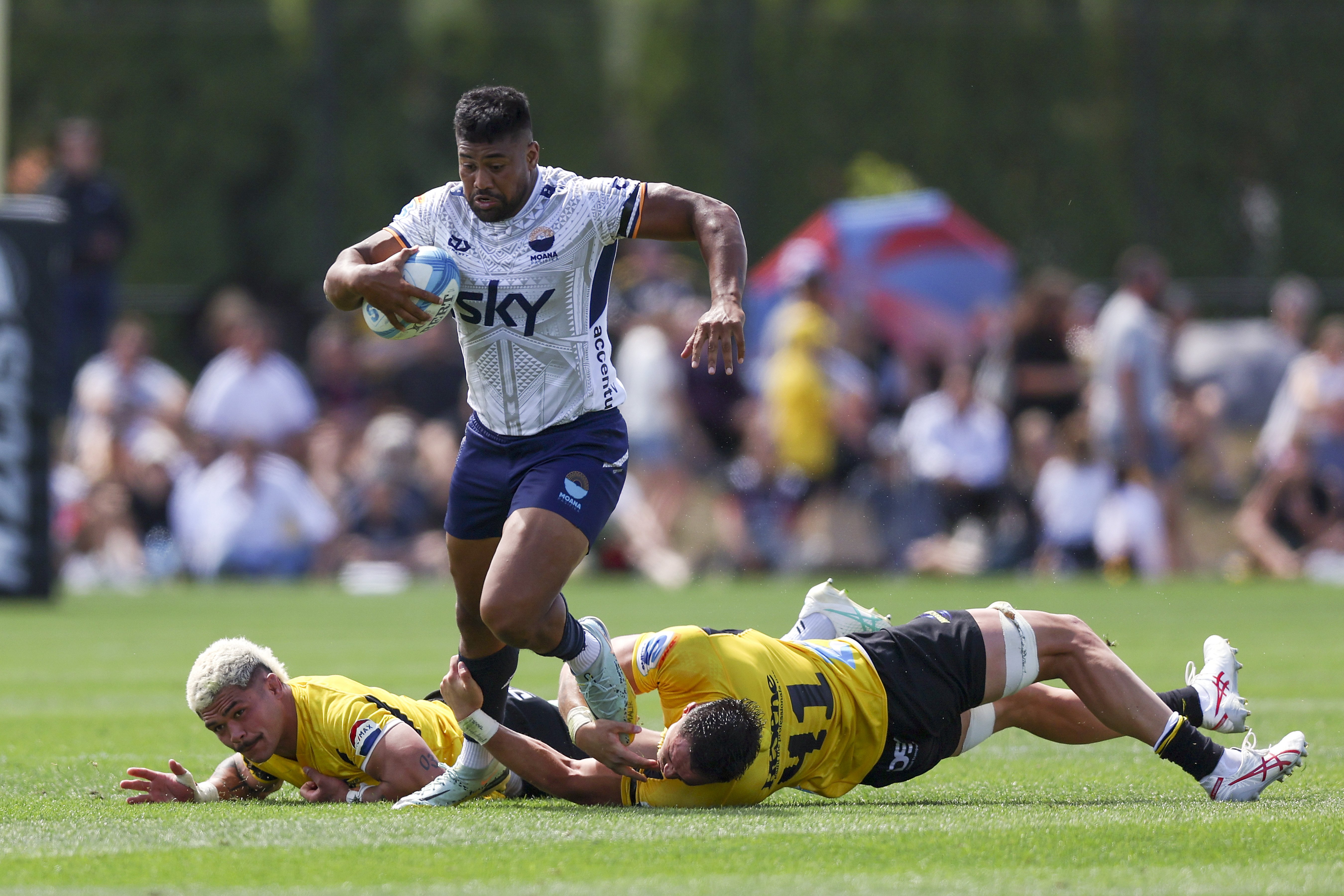 Moana Pasifika winger Julian Savea on the charge against his former team, the Hurricanes, in...