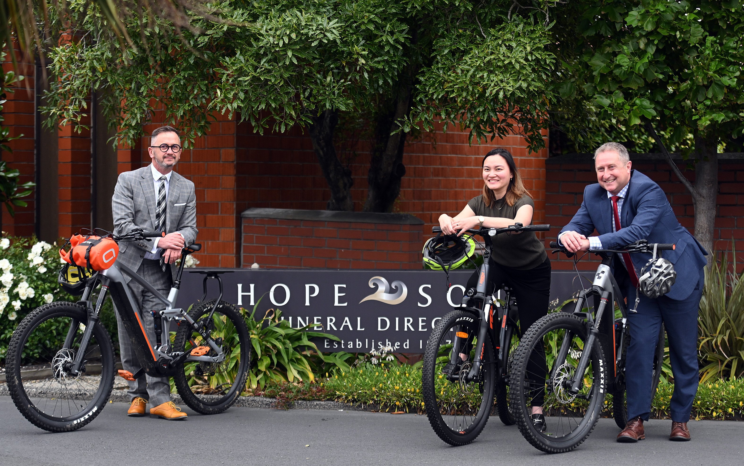 Hope & Sons employees (from left) Chaim Cleavin, Mai Gaane and Andrew Maffey stand with their new...