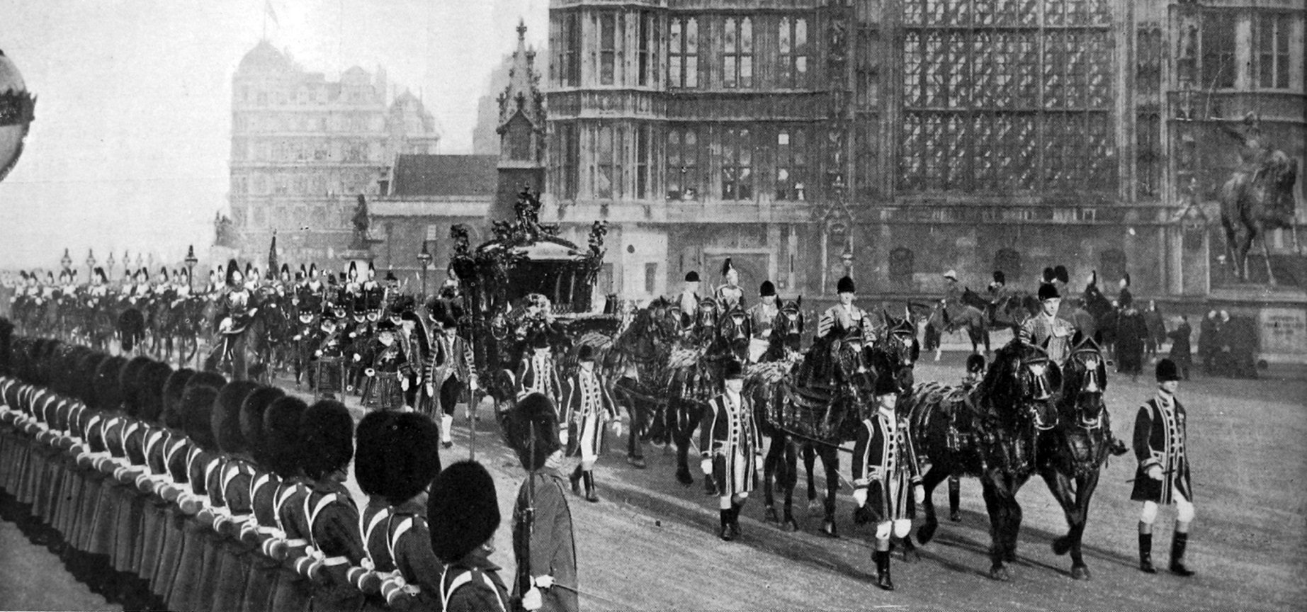 King George V arrives at Westminster aboard the State Coach to open the British parliament. —...