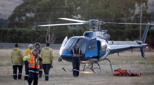 A helicopter prepares to take off to join firefighters battling the fire in Waikari Valley. Photo...